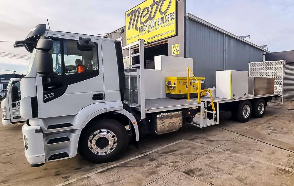 Civil construction custom beavertail truck body with side-mounted toolboxes, generator storage and side access lift, built by Metro Truck Body Builders in Seaford, Melbourne.