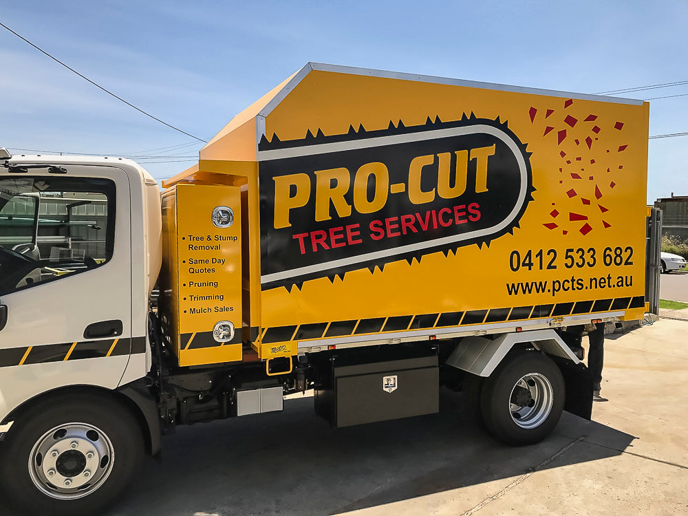 Custom chipper tipper body with large behind-cab toolbox built by Metro Truck Body Builders in Seaford, Melbourne, Victoria. PRO-CUT TREE SERVICES