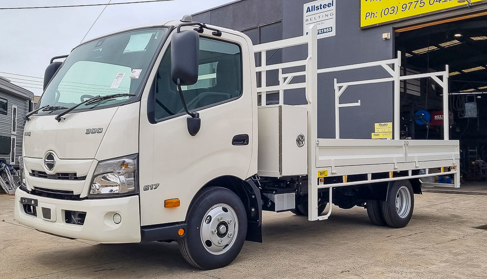 Custom split drop side truck tray with removable ladder racks and cabin-mounted toolbox by Metro Truck Body Builders
