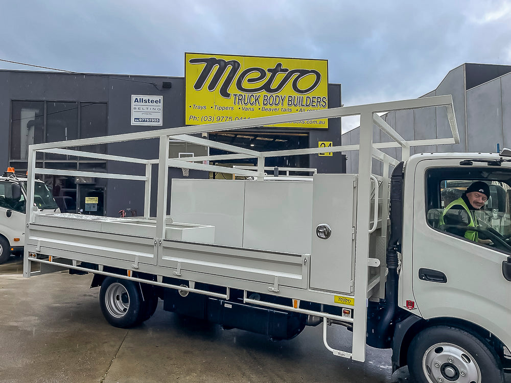 Custom drop side tray configured for carrying long materials