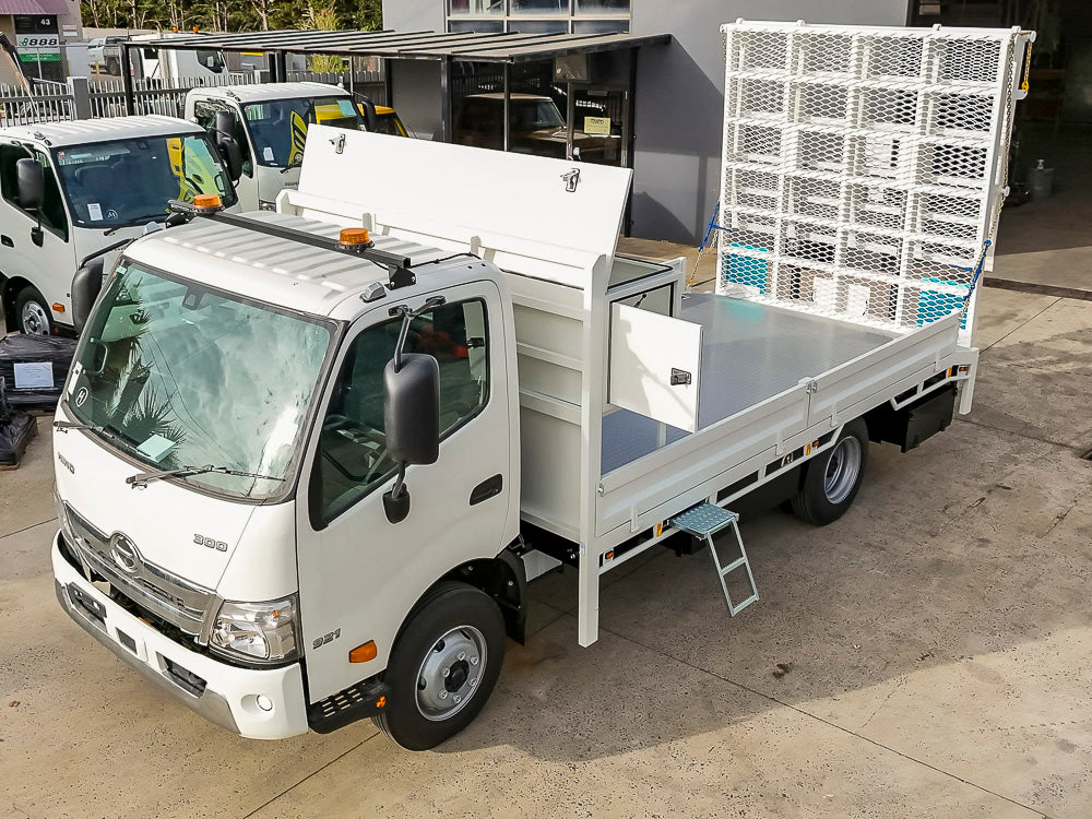 Custom drop side truck tray with bi-fold hydraulic loading ramp built by Metro Truck Body Builders Melbourne