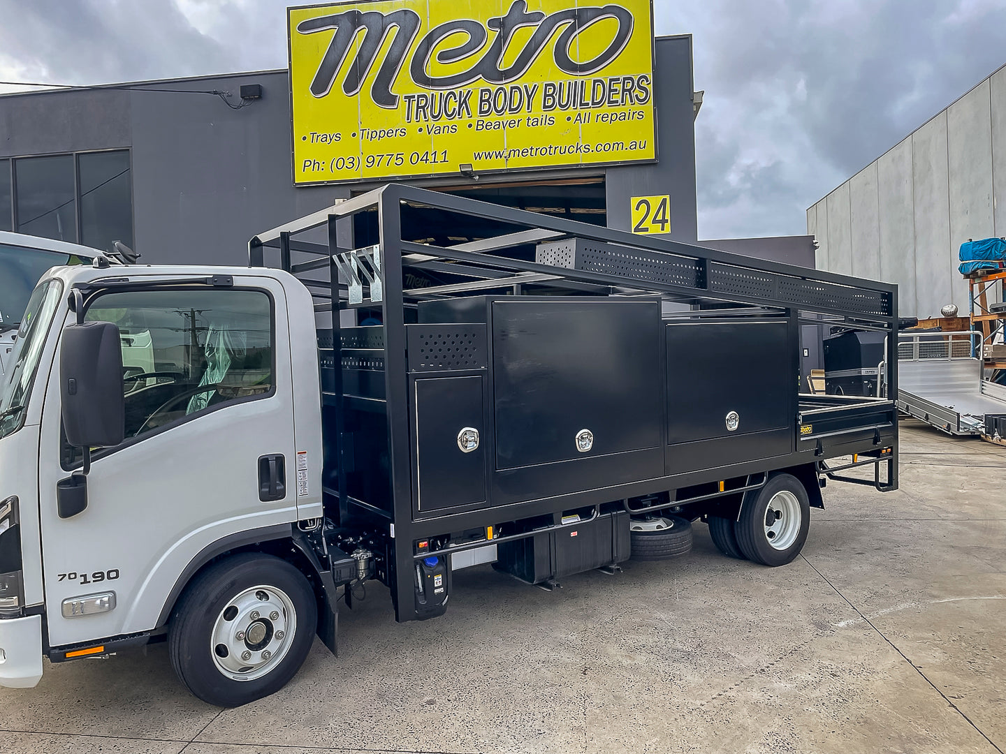 Custom concreters truck body with fixed REO hurdles, screed box and customised toolboxes built by Metro Truck Body Builders in Melbourne.