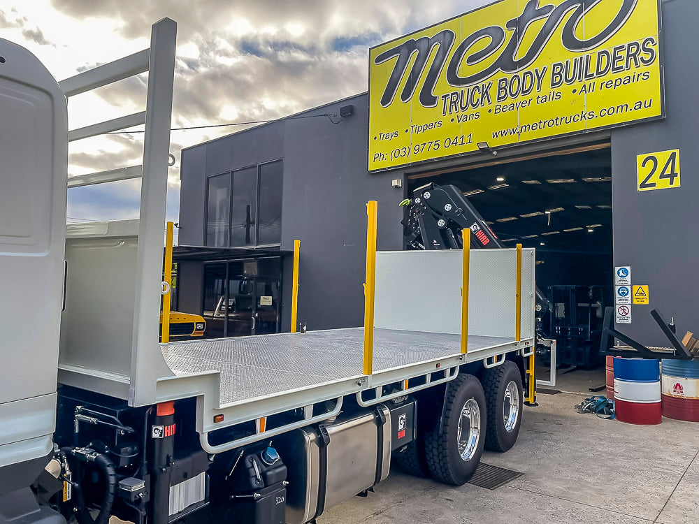 Custom flat tray truck body with large crane and SpanSet safety railing built by Metro Truck Body Builders Melbourne.