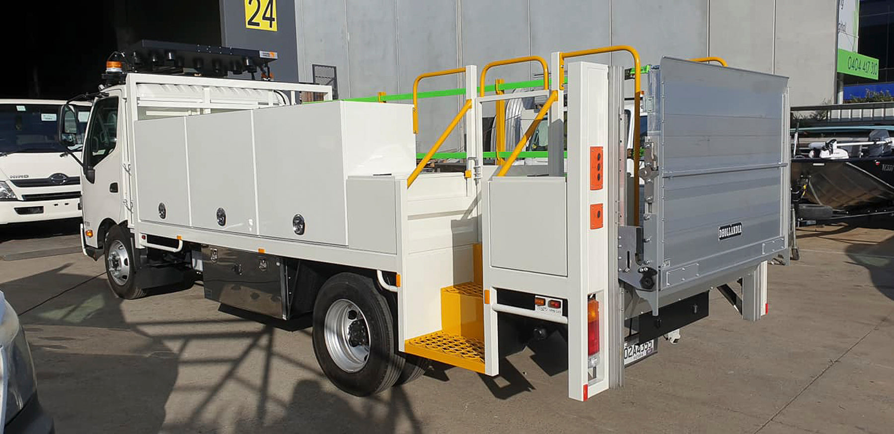 Custom on-tray truck toolboxes integrated into aservice body by Metro Truck Body Builders Melbourne.